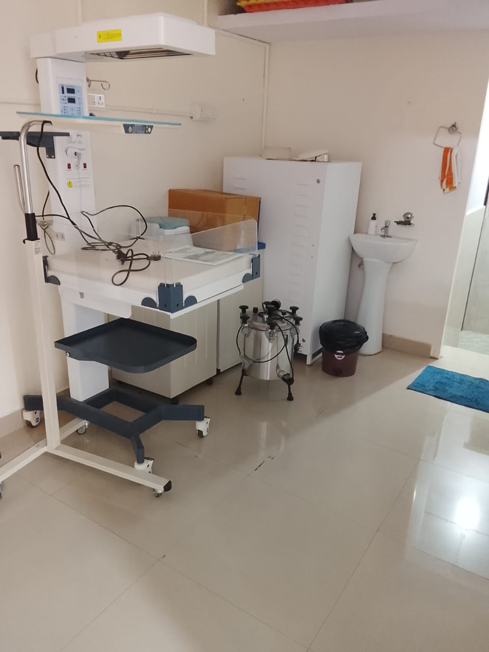 Medical room with equipment and sink.